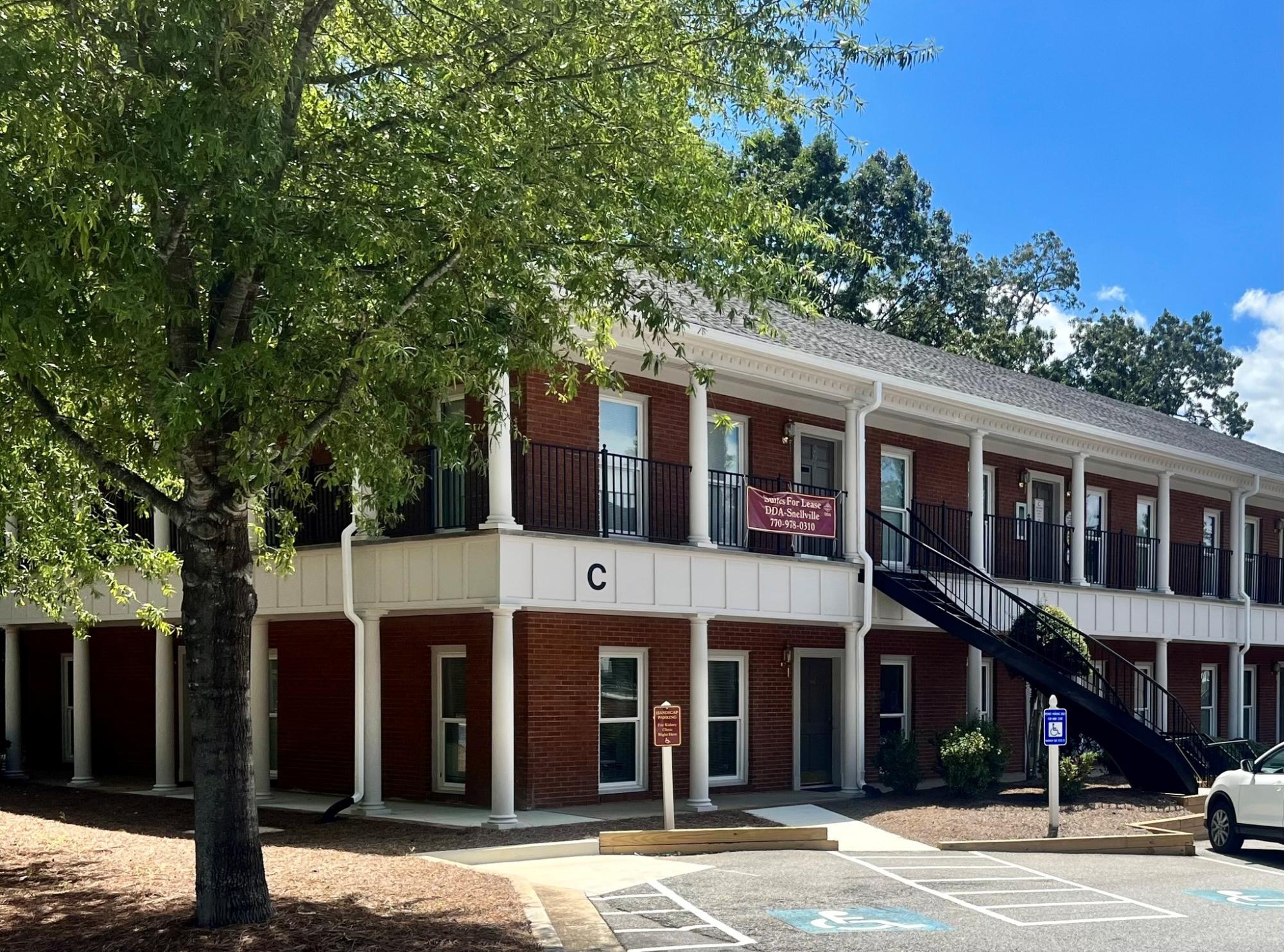 view of two story brick office building